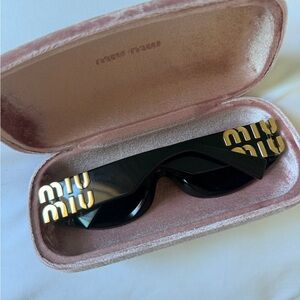 Miu Miu Black and Gold Sunglasses